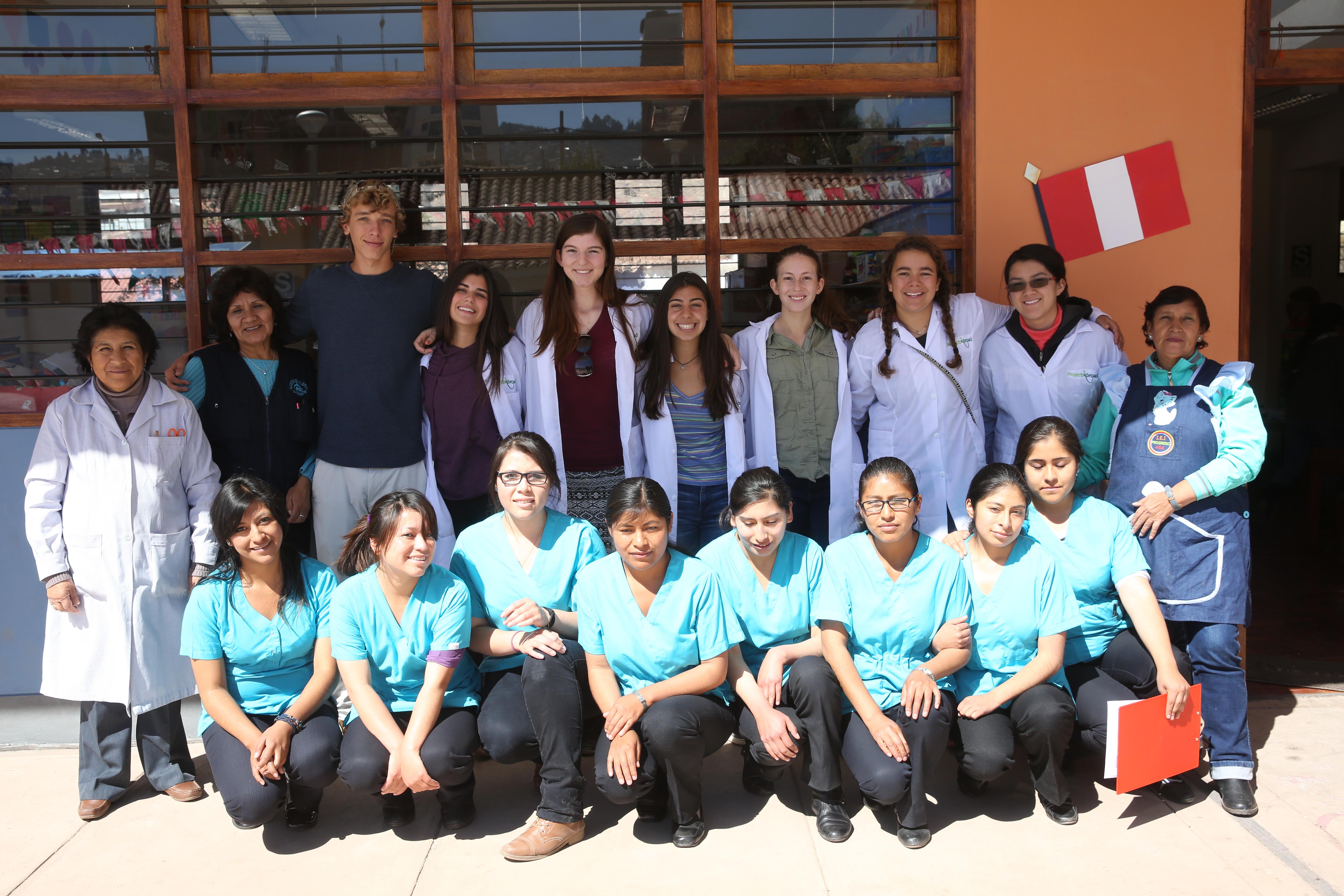 A group of high school students pose outside their placement on our medical internship in Peru A group of Projects Abroad interns on our medical internship for teenagers in Peru
